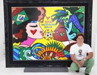 O artista Romero Britto junto a um quadro elaborado especialmente para o mundial de 2014(foto: Fifa/Divulgao)
